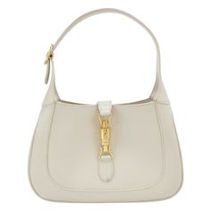 Gucci Jackie 1961 White Leather Bag with Adjustable Strap Size Small These are professional photos of the actual bag offered by Luxbags. The Gucci Jackie 1961 White Small bag is a modern take on an iconic design. Crafted in leather with a structured silhouette, it features a crossbody strap so you can bring your essentials wherever life takes you. Its baby blue hue is sure to add a touch of elegance to your wardrobe. CONDITION: VERY GOOD This preloved authentic bag is in very good condition with moderate signs of use throughout. Stains on the bottom and rubbing around the corners. DETAILS GUCCI Jackie 1961 White calfskin leather Beige suede lining Gold-tone hardware Piston lock Size Small Width: 27cm x Height: 18.5 x Depth 3.5cm ACCESSORY: Adjustable long shoulder strap Gucci Jackie White, Jackie Gucci Bag, White Gucci Bag, Gucci Jackie 1961, White Leather Bag, Gucci Purse, Gucci Purses, Professional Photos, Authentic Bags