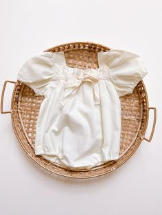 Vintage-style baby romper with balloon sleeves and feminine details delicately crafted from naturally breathable cotton.  It is both a great everyday choice and special occasion wear.  - Snaps for easy diaper changes - Color: Light Yellow - Square neck with tie detail  - Elastic leg opening - 100% Cotton Cotton Bubble Romper With Short Sleeves For Baptism, Cream Cotton Bubble Romper With Short Sleeves, Cream Short Sleeve Bubble Romper For Summer, Cotton Bubble Romper For Baptism In Summer, Cream Bubble Romper For Summer Baptism, Cute Cream Cotton Bubble Romper, Summer Bubble Romper With Ruffles And Puff Sleeves, Summer Puff Sleeve Bubble Romper With Ruffles, Spring Baptism Cream Bubble Romper