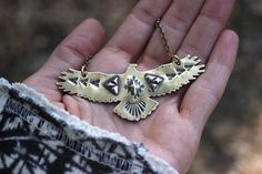 "This listing is for one hand stamped brass hawk necklace. Wear this bohemian necklace to show your affinity and love for all things natural, spiritual, and sky-bound. It is a powerful and eye-catching piece. - Hawk is made from 18 gauge brass sheet metal. This is a sturdy piece- it is not flimsy. - Pendant measures 3\" by 1 1/4\" (75mm by 30mm) - Chain in photo measures 16\" from end to end, but can be lengthened to your preference. Choose at check-out! Also, I can suspend it on black or brown Artisan Stamped Brass Jewelry, Bohemian Brass Stamped Jewelry, Bohemian Stamped Brass Jewelry, Handmade Southwestern Gold Necklace, Southwestern Handmade Gold Necklace, Festival Etched Brass Jewelry, Bohemian Engraved Brass Necklaces, Bohemian Brass Jewelry With Engraving, Bohemian Brass Jewelry With Engraved Details