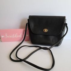 Vintage CoachQuincy BagBlack leather with brass hardwareRoomy interior with slip pocketcovered by a flap and securedwith a turnlockMade in the United States#B5D-9919Measures: 9"L, 7"H, 3"WStrap measures: 52"Can be worn over shoulder or crossbody if possible Made in the United StatesCleaned, conditioned and ready to wear!Questions? Just askMore vtg coach styles/colors also availableLr Rectangular Flap Bag With Cc Turnlock Closure, Classic Double Flap Shoulder Bag With Cc Turnlock Closure, Classic Shoulder Bag With Cc Turnlock And Double Flap, Classic Flap Bag With Cc Turnlock Closure, Classic Travel Bag With Cc Turnlock Closure, Vintage Rectangular Bag With Cc Turnlock Closure, Black Satchel With Cc Turnlock Closure For Travel, Evening Crossbody Satchel With Cc Turnlock Closure, Leather Flap Bag With Cc Turnlock For Daily Use