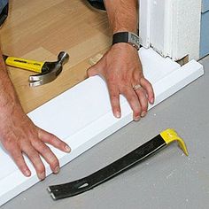 a man is working with tools on the floor