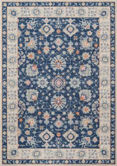 a blue and white rug with an intricate design