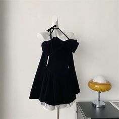 a mannequin with a black dress on it