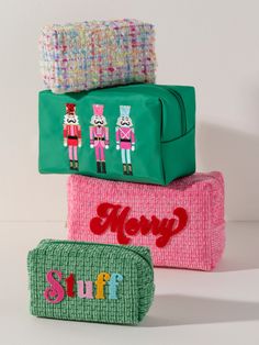 Carry all your odds and ends in style with Shiraleah's “Stuff” Zip Pouch! This petite pouch is the perfect size to store makeup, jewelry, and all your smallest miscellaneous items. Made from trendy tweed fabric in a charming green color with a subtle sparkle of lurex thread, the compact cosmetic case features the word “Stuff” embroidered across the front in whimsical, multicolored letters. Pair with other items from Shiraleah's Merry Everything Collection to complete your look! Shiraleah is a tr Playful Zipper Pouch Cosmetic Bag As Gift, Playful Rectangular Cosmetic Bag For Personal Use, Gift Cosmetic Bag With Removable Pouch In Green, Trendy Multicolor Pouch For Gift, Trendy Multicolor Pouch As Gift, Spa Wraps, Dark Green Background, Miscellaneous Items, Accessories Display