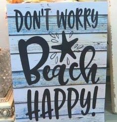 a sign that says don't worry, beach happy on the side of a shelf