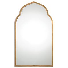 an arched mirror on a white wall