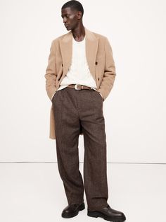 This relaxed pant is cut from a herringbone wool-blend fabric we selected from one of our favorite Italian mills, woven for a warm-handed flannel finish.  Here, we've cut this fabric into a pleated, wide-leg pant with a distinctive puddle hem.  Mid rise.  Wide leg with extra length for a break at the hem Fabric from Italy's Fratelli Balli.  Zip-fly with button closure.  Belt loops.  Front and back pockets.  Lined to the knee.  Wide-leg fit: Mid rise.  Tailored for the at-ease fit of traditional trousers, but with the extra wide-leg and full length of puddle-hem pants.  Wide leg opening measures 10" flat.  Full length.  Inseams: Regular 31. 5" Model: Size 32, 6'2" (188cm). Hem Pants, How To Hem Pants, Latest Mens Fashion, Wool Trousers, Shop Mens Clothing, Bottom Clothes, Mens Trousers, Sweater Shop, Bottoms Pants