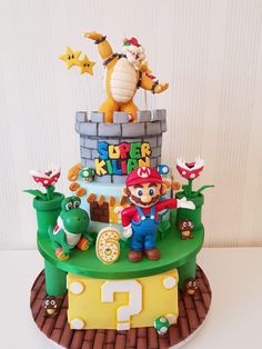 a birthday cake with an image of mario and luigi on the top is made out of fondant