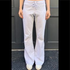 Soft Cotton Blend Tie Yoga Pants With A Big Flare Pant Leg. Fabrics: 100% Cotton Measurement: 10" (30 Cm) Rise, 34" (81 Cm) Inseam, 15" (66 Cm) Waist (Stretches) Made In: Italy Fitted Sweatpants With Elastic Waistband For Loungewear, Fitted Full-length Cotton Sweatpants, Fitted Full-length Sweatpants With Elastic Waistband, Fitted Cotton Sweatpants For Lounging, Fitted Cotton Bottoms For Lounging, Fitted Cotton Lounge Pants, Fitted Cotton Pants For Lounging, Fitted Wide Leg Pants For Loungewear, Athleisure Fitted Wide-leg Pants