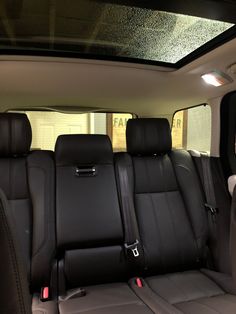 the interior of a car with black leather seats and no one in it is shown