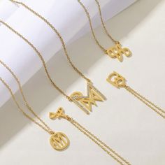 Personalize Your Style with Our Logo Name Necklace. Crafted with precision and attention to detail, this necklace is the perfect way to showcase your personal style. Metal: Stainless Steel Available in a variety of finishes: 🌹 Rose Gold 🟡 18k Gold 🥈 Silver 🌹 Iced Rose Gold + 💎 Cubic Zirconia 🟡 Iced 18k Gold + 💎 Cubic Zirconia 🥈 Iced Silver + 💎 Cubic Zirconia The chain length options include: - 16" - 18" - 20" - 22" Each necklace is meticulously: ✨ Designed ✨ Polished ✨ Assembled Please Elegant Metal Necklace As A Gift For Her, Elegant Stainless Steel Necklace, Luxury Personalized Gold Initial Necklace, Symbolic Gold Initial Pendant Jewelry, Gold Chain Necklace With Initial Pendant, Elegant Gold Initials Necklace, Metal Necklace With Adjustable Chain As Gift For Her, Metal Clavicle Chain Necklace For Her, Elegant Gold Initial Pendant Name Necklace