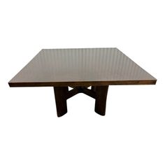 a wooden table sitting on top of a white background