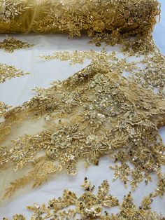 some gold sequins are laying on a table