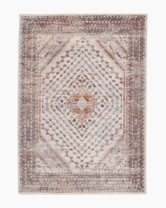 a rug with an intricate design on the front and back side, in neutral tones