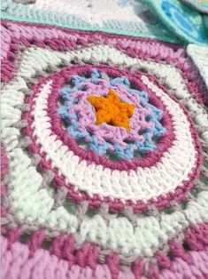 there is a crocheted blanket with a star on it