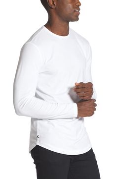 Made from a soft cotton blend, a versatile long-sleeve T-shirt enhanced with a curved hem is an instant closet favorite that looks great alone or layered. Crewneck Long sleeves 62% polyester, 33% cotton, 5% spandex Machine wash, tumble dry Imported Long Sleeve Cotton T-shirt For Loungewear, Stretch Long Sleeve T-shirt With Thumbholes, Stretch Long Sleeve T-shirt For Layering, White Tops With Thumbholes For Loungewear, Stretch Long Sleeve T-shirt For Everyday, Everyday Stretch Long Sleeve T-shirt, Everyday Cotton Stretch Long Sleeve Top, Cotton Stretch Long Sleeve Top For Everyday, Everyday Stretch Cotton Long Sleeve Top