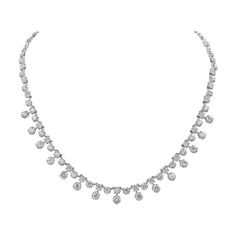 A modern and chic necklace style showcasing round brilliant diamonds weighing 7.81 carats total; Set in a starburst-like setting made in 18 karat white gold. A very brilliant piece of jewelry. 16 inches in length. Round Diamond Necklace, White Necklaces, Diamond Drop Necklace, The Bling Ring, Diamond Tennis Necklace, Choker Style Necklace, Chic Necklace, Diamond Choker, Luxury Necklace