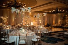 Gold and White Ballroom Reception Décor Wedding Reception Ballroom, Ballroom Wedding Reception, Uplighting Wedding, Candlelit Reception, Gold Reception, Indian Reception, Indoor Wedding Receptions, Reception Backdrop, Inside Weddings