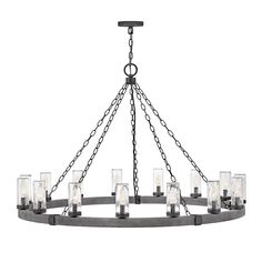 a chandelier with many lights hanging from it's center chain and glass cylinders