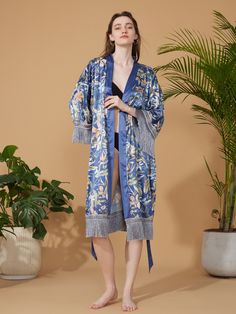 Crafted with meticulous attention to detail, our kimono robe embodies the essence of Eastern luxury, offering you a truly indulgent experience every time you slip it on. Its versatile design effortlessly transitions from leisurely mornings to elegant evenings, ensuring you stay elegant and refined throughout the day. • Silky Comfort: Made of high-quality polyester charmeuse, our robes are soft, lightweight and cooling for summer. They have a smooth and breathable texture that feels just like nat Elegant Wrap Robe For Vacation, Elegant Wrap Kimono With Floral Print, Elegant Blue Floral Print Kimono, Silk Kimono With Floral Print For Loungewear, Elegant Kimono With Kimono Sleeves For Tea Ceremony, Elegant Long Kimono For Tea Ceremony, Elegant Floral Print Wrap Robe, Elegant Long Robe For Vacation, Elegant Long Vacation Robe