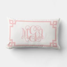 a pink and white monogrammed pillow with the word'm'on it