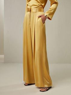 Looking for a bottom that is both stylish and comfy? Well, this pair of ankle-length palazzos in lemon drop is a perfect pick. Crafted from high-quality watershine silk, these pants offer a comfortable and loose fit. The glossy finish of the fabric adds a touch of elegance and sophistication to your overall look. Be it your casual outing or a light festive look, it will go for each occasion. Pair these pants with our matching ensemble, and create a head-turning outfit that exudes confidence and allure. Silk Palazzo Pants, Head Turning Outfits, Women's Bottoms, Silk Trousers, Beautiful Color Combinations, Lemon Drop, Silk Pants, Autumn Cozy, High Waisted Trousers