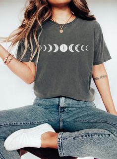 Moon Phase Shirt, Cute Boho Tee, Witchy Shirt, Mystic Moon Shirt, Astronomy Tee, Astology Lover TShirt, Celestial Tshirt, Birthday Gift Greetings and a warm welcome to our shop! We're thrilled to have you here, and your presence brightens our day! 😊  SIZING ❤  - Please refer to size chart on the listing photos for a detailed sizing chart with measurements. - Unisex sizing. - If you are seeking an oversize look be sure to order 1 to 2 sizes up from your regular size. - Since all shirts are made Relaxed Fit Moon Print Short Sleeve Tops, Trendy Crew Neck T-shirt With Moon Print, Trendy Cotton T-shirt With Moon Print, Moon Print Relaxed Fit Crew Neck T-shirt, Trendy Relaxed Fit Top With Moon Print, Casual Crew Neck Top With Moon Print, Relaxed Fit Short Sleeve T-shirt With Moon Print, Cotton Crew Neck Top With Moon Print, Graphic Tee Shirt With Moon Print