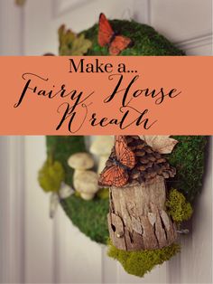 a wreath with moss, pine cones and butterflies hanging from it's front door