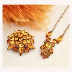 1960s Yellow Topaz Rhinestone Demi Parure Necklace & Brooch Set - 1960s Topaz Jewelry - Vintage Topaz Jewelry Set - 1960s Topaz Necklace  This color Professionally designed with no hallmarks to note. The set features silver tone metal settings and gorgeous yellow topaz cut glass stones. The necklace is on a medium drop cable chain with a box clasp closure. The brooch is a large domed starburst covered in prong set brilliant faceted stones. The brooch fastens with with a c-clasp pinback.  Conditi Retro Bride, Topaz Jewelry, Topaz Necklace, Diamond Brooch, Box Clasp, Beautiful Hats, Vintage Costume Jewelry, Jewelry Vintage, Clear Rhinestones