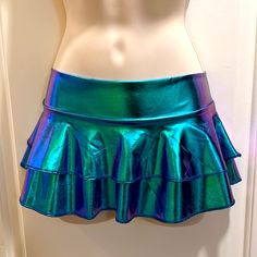 The Color Is A Shimmering, Holographic Blue-Green. Very Shiny. I Would Call It “Mermaid Blue” Sz. Small. Made To Show Off Your Cheeks. A Great Addition To Your Electric Rave Attire. Rave Attire, Rave Skirt, Holographic Blue, Women Crafts, Womens Skirt, Blue Green, Mermaid, Lounge, Skirt