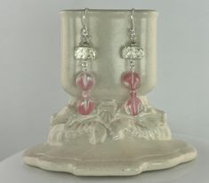 Each sterling silver earring has two lovely vintage rosy, pink, roseate, spoonbill bird, Spatule Plateino, wing pattern Givre crystal beads accented by a vintage carved German crystal bead and a faux baroque pearl bead. These Dewees Island vibes earrings are designed to be light weight for comfortable wearing. The drop length is 1.25 inches. The 925-sterling silver French hooks are comfortable and lightweight: the earring hook size is 20x15mm, the wire size is 0.8mm. These earrings coordinate wi Nickel-free Pink Beaded Earrings, Pink Sterling Silver Jewelry With Round Beads, Nickel Free Pink Round Bead Earrings, Pink Nickel-free Round Bead Earrings, Pink Nickel-free Round Beaded Earrings, Pink Czech Glass Dangle Jewelry, Pink Round Beads Earrings Nickel Free, Adjustable Pink Sterling Silver Beaded Earrings, Pink Sterling Silver Beaded Earrings