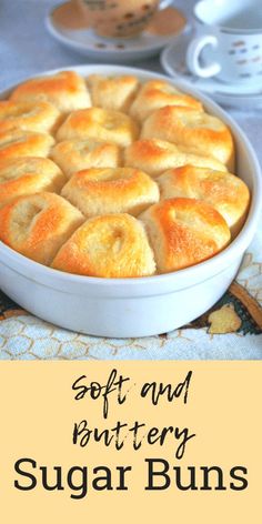 soft and buttery sugar buns in a white baking dish on a yellow background