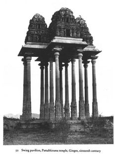 an old black and white photo of some pillars