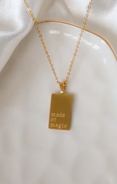 This timeless Magic Necklace features a stainless steel 18k gold plated chain and a rectangular retro-engraved pendant, offering elegance and luxury that will endure. Crafted with a sophisticated and exclusive style, this piece of jewelry will make a tasteful statement for all occasions. Stainless Steel Necklace With Rectangular Links For Gifts, Engraved Stainless Steel Rectangular Jewelry, Rectangular Stainless Steel Necklaces, Rectangular Stainless Steel Tarnish Resistant Necklaces, Magic Necklace, Engraved Pendant, Gold Plated Chains, 18k Gold, Gold Necklace