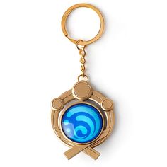 a golden key chain with a blue circular object on it