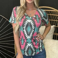 Make A Statement With This Fierce V-Neck Top! Boasting A Sleek Pink, Turquoise, Gray And White Aztec Pattern, It's Sure To Turn Heads! Fit Is True To Size. 55% Cotton 40% Polyester 5% Spandex Casual Pink V-neck Top For Summer, Casual Pink V-neck Top With Short Sleeves, Trendy Pink V-neck T-shirt, Trendy Pink V-neck Top, Affordable Clothing Websites, Aztec Pattern, Clothing Websites, Pink Turquoise, V Neck Tops