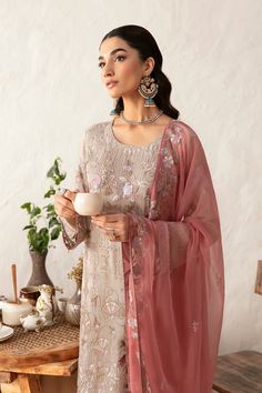 Brand: RamshaCollection: Rangoon Volume 12 Luxury Chiffon CollectionFabric: Chiffon PRODUCT DETAILS: Embroidered Chiffon front with sequins Embroidered Chiffon back Embroidered Chiffon sleeves Embroidered organza sleeves lace Embroidered organza ghera lace Embroidered Chiffon dupatta– 2.5 Yard Raw silk trouser – 2.5 Yard Embroidered organza trouser laces DISCLAIMER:* Lining, Laces, and Tassels are not included in unstitched variants.* Embellishment items in stitched outfits are subject to market availability.* The actual colors of the outfit may vary from the colors being displayed on your device. CARE INSTRUCTIONS: Extra Fabric Has Been Used For Shoot Original Color May Vary Slightly From The Picture Dry Clean Recommended Iron The Clothes At Moderate Temperature Do Not Use Bleach, Or Stai Pastel Gray, Pakistani Designer Clothes, Black Lehenga, Chiffon Sleeves, Organza Sleeves, Chiffon Collection, Embroidered Chiffon, Embroidered Organza, Luxury Wear