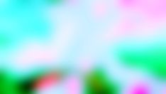 blurry image of green, pink and blue colors