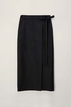 Dunst maxi tie skirt in black.    80% polyester20% nylon.    udsk4c20 7bk    pipe and row Black Lined Maxi Skirt For Work, Black Maxi Skirt For Workwear In Summer, Black Maxi Skirt For Summer Workwear, Black Pencil Maxi Skirt For Office, Elegant Black Skirt With Tie Waist, Black Belted Asymmetrical Skirt, Black Asymmetrical Belted Skirt, Black Lined Wrap Skirt For Work, Elegant Skirt With Tie Waist For Work