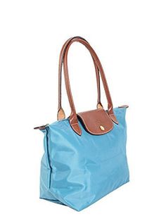 Longchamp Small Le Pliage Shoulder Bag Blue Handbag Bag NEW Embossed leather trims a water-resistant nylon tote that folds into a compact shape for storage. Top zip closure with outer snap tab. Interior wall pocket. Water-resistant lining. Folds flat for storage. Nylon with leather trim. By Longchamp; imported. Handbags. 9 W x 9 H x 5 D. (Interior capacity: small.) 8" strap drop. Blue Packable Tote Shoulder Bag, Packable Blue Shoulder Bag, Packable Shoulder Bag For Travel, Blue Packable Travel Bag, Blue Foldable Travel Bag, Blue Bags With Leather Trim And Double Handle, Everyday Blue Foldable Bag, Blue Packable Bags For Travel, Packable Tote Shoulder Bag For Travel