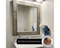 a bathroom sink with a mirror above it and the words, 20 colors & custom sizes