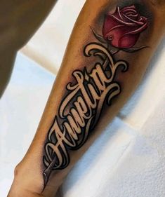 a person with a rose tattoo on their arm