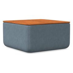 a blue ottoman with a wooden top