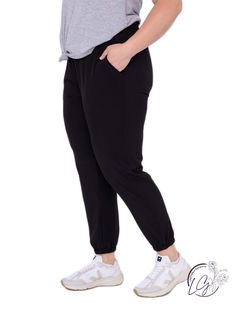 These solid-colored joggers are ready for your next adventure. They feature a high, elasticized waistband (with drawstring closure), slanted pockets, and a 7/8 length with cuffed ankles.Fabric: 92% polyester & 8% spandex.Moisture-wicking.Four-way stretch. Solid Ankle-length Athleisure Joggers, Solid Sweatpants With Elastic Waistband For Jogging, Relaxed Fit Joggers With Elastic Cuffs For Jogging, Solid Color Sweatpants With Elastic Waistband For Jogging, Sporty Joggers With Elastic Waistband For Leisure, Athleisure Sweatpants With Elastic Side Panels For Leisure, Athleisure Bottoms With Elastic Side Panels For Leisure, Relaxed Fit Joggers With Side Pockets For Jogging, Athleisure Sweatpants With Side Pockets For Leisure