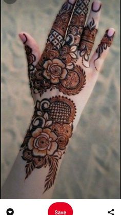 the hand is decorated with henna and flowers