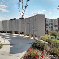 a row of mail boxes sitting on the side of a road