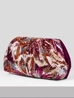 In stock and ready to ship in 1-2 business days. This chic and versatile clutch features a mesmerizing array of multicolored sequins on the front, creating a stunning visual effect that catches the light and captures attention. The back is crafted from luxurious velvet in a gorgeous shade of fuchsia, adding a soft and tactile element to the design. Inside, you'll find a convenient zip pocket, providing a secure space for your essentials. Measurements: 14.17 IN/36 CM (L) x 1.57 IN/4 CM (W) x 7.87 Multicolor Sequined Evening Bag, Glamorous Multicolor Clutch For Party, Evening Multicolor Sequins Bag, Glamorous Multicolor Bags For Events, Glamorous Multicolor Evening Bag, Glamorous Multicolor Event Bags, Multicolor Clutch Bag For Party, Multicolor Sequined Evening Clutch, Sequined Pouch Clutch For Parties