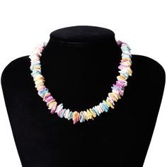 Strung on a 38 cm chain, this colorful piece is made up of different clam chip fragments painted with a mix of pastel colors. Each piece is set in either a lovely pink, ocean blue, golden yellow, or pearly white, or another beautiful pastel shade. Each piece is jaded and unique, making the entire necklace give off a natural appeal. This Innovato Design necklace ends with a stainless steel lobster claw clasp and a 7 cm extender link chain. The extender chain allows the wearer to adjust the length of the necklace.  Product Highlights    Made from natural clam chips  Multicolor Pastel Design  Durable lock and clasp Shell-shaped Colorful Bead Necklaces For Gifts, Multicolor Shell Necklace As A Gift, Multicolor Shell-shaped Necklaces For Beach, Multicolor Shell-shaped Necklace For Beach, Multicolor Shell Necklaces With Colorful Beads, Multicolor Shell-shaped Necklace For Gift, Multicolor Shell Jewelry For Gifts, Multicolor Shell Necklace For Gift, Multicolor Shell Jewelry As A Gift