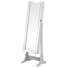 a white standing mirror on top of a stand