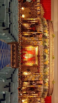 the interior of a large church with gold and red decorations on it's walls